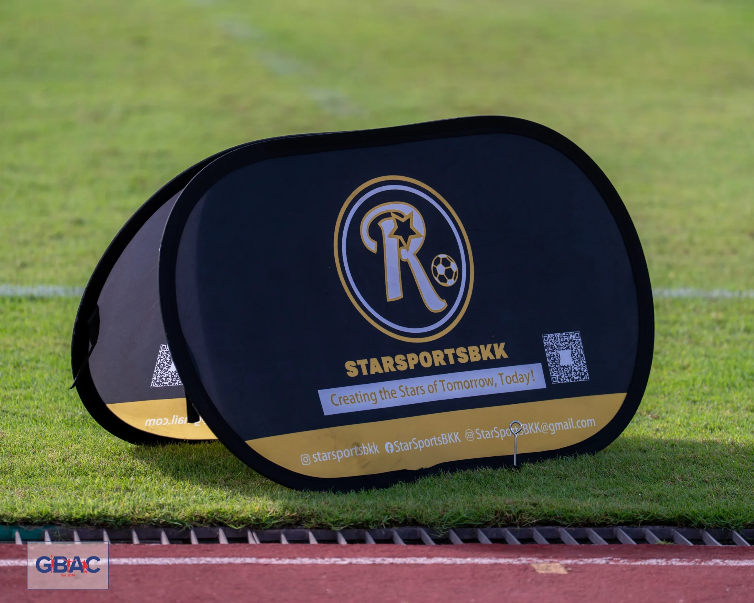 A Star Sports BKK promotional banner placed on the sideline of the GBAC football field